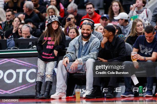 Rapper Drake smiles as he sits courtside with Future The Prince during the second half of the NBA game between the Toronto Raptors and the Brooklyn...