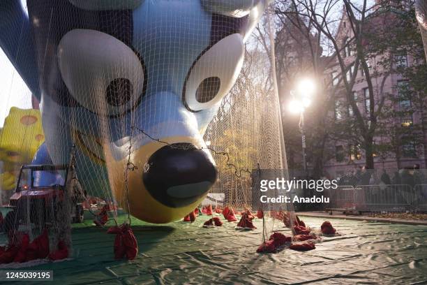 The Macy's inflation team works on giant balloons as they prepare ahead of the 96th Macy's Thanksgiving Day Parade in New York City, United States on...