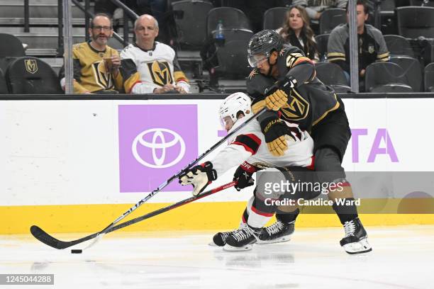 Tyler Motte of the Ottawa Senators battles for the puck with Keegan Kolesar of the Vegas Golden Knights in the third-period of their game at T-Mobile...