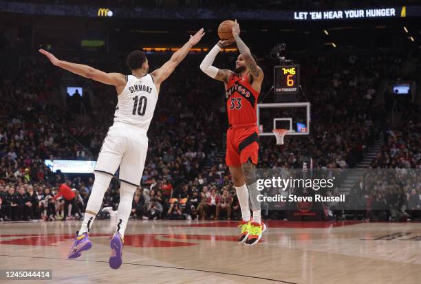 Toronto Raptors guard Gary Trent Jr. Shoots as Brooklyn Nets guard Ben Simmons defends as the Toronto Raptors fall to the Brooklyn Nets at Scotiabank...