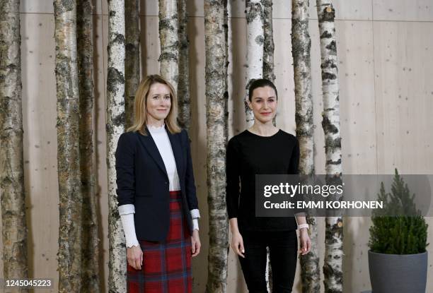 Prime Minister of Estonia Kaja Kallas and Prime Minister of Finland Sanna Marin pose as they attend the "Into the Woods" event at the Finnish Nature...