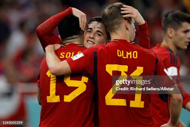 Gavi of Spain celebrates with Carlos Soler of Spain and Dani Olmo of Spain during the FIFA World Cup Qatar 2022 Group E match between Spain and Costa...