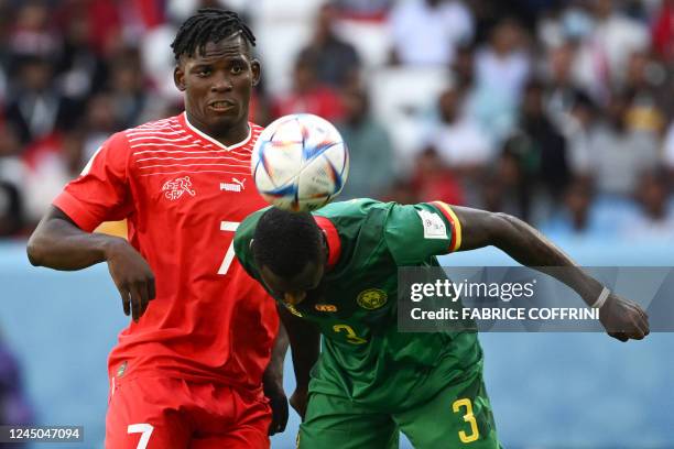 Cameroon's defender Nicolas Nkoulou heads the ball past Switzerland's forward Breel Embolo during the Qatar 2022 World Cup Group G football match...