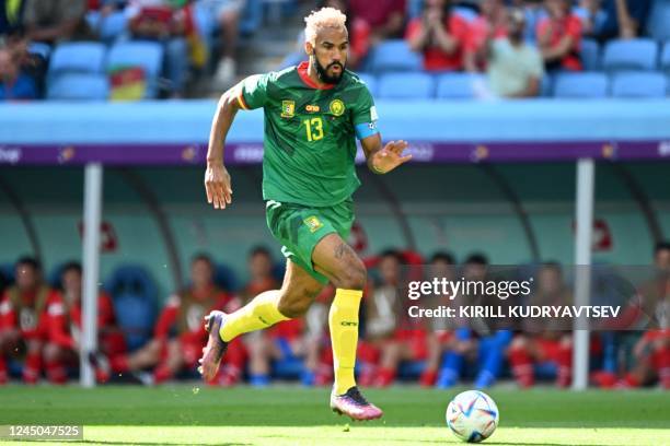Cameroon's forward Eric Maxim Choupo-Moting runs with the ball during the Qatar 2022 World Cup Group G football match between Switzerland and...