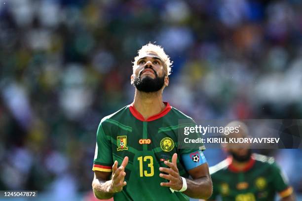 Cameroon's forward Eric Maxim Choupo-Moting reacts after a missed opportunity during the Qatar 2022 World Cup Group G football match between...