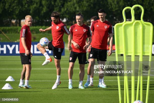 Wales' midfielder Aaron Ramsey, Wales' midfielder Joe Allen, Wales' forward Gareth Bale and Wales' forward Kieffer Moore take part in a training...