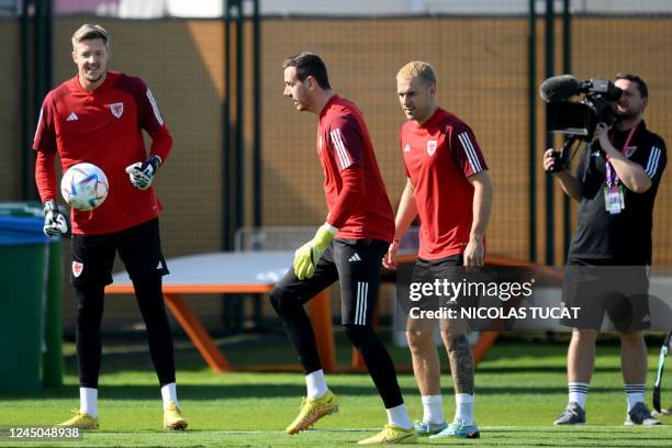 Wales' goalkeeper Wayne Hennessey, Wales' goalkeeper Danny Ward and Wales' midfielder Aaron Ramsey takes part in a training session at Al Sadd SC in...