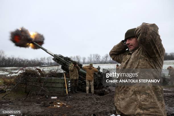 Ukrainian artillerymen fire a M777 howitzer towards Russian positions on the frontline of eastern Ukraine, on November 23 amid the Russian invasion...