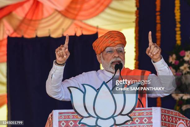 India's prime minister Narendra Modi addresses a gathering during a Bhartiya Janata Party rally ahead of Gujarat state elections at Dehgam, some 40...