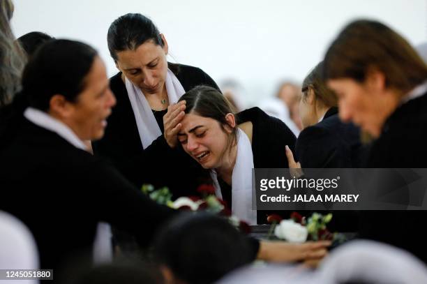 An Israeli Druze woman reacts in front of the body of 17-year-old Tiran Fero, on November 24 during his funeral ceremony in Daliyat al Karmel, around...