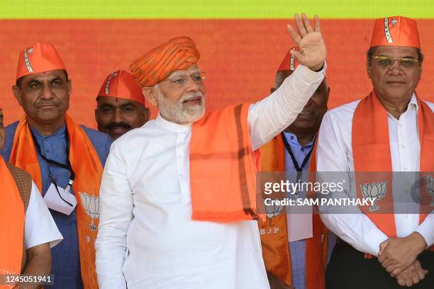 India's prime minister Narendra Modi arrives to address a gathering during a Bhartiya Janata Party rally ahead of Gujarat state elections at Dehgam,...