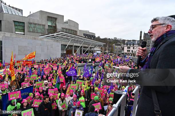 Members of the EIS teachers union and supporters demonstrate outside the Scottish Parliament, many with their children, as schools across Scotland...