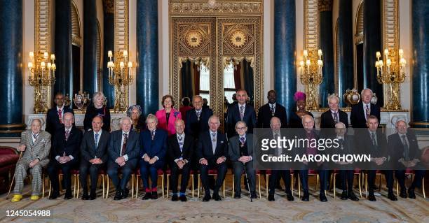 Britain's King Charles III , poses with Members of the Order of Merit, Back row from Left, Dr Venki Ramakrishnan, Professor Margaret Macmillan,...