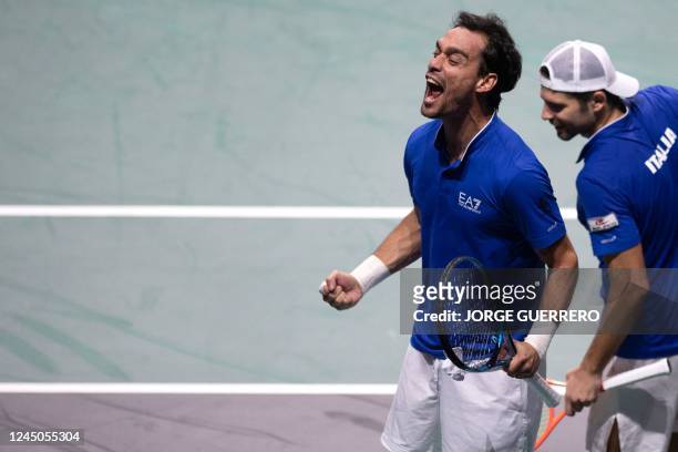 Italys Simone Bolelli and Fabio Fognini celebrate after winning at the end of the men's double quarter-final tennis match between Italy and United...