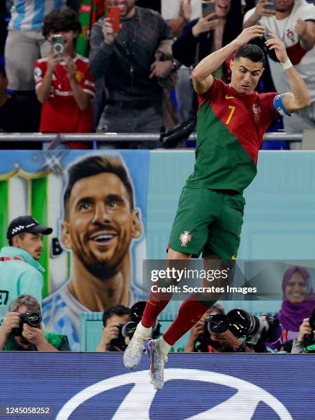 Cristiano Ronaldo of Portugal celebrates 1-0, banner of Lionel Messi in the background during the World Cup match between Portugal v Ghana at the...