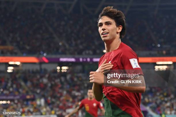 Portugal's forward Joao Felix celebrates scoring his team's second goal during the Qatar 2022 World Cup Group H football match between Portugal and...