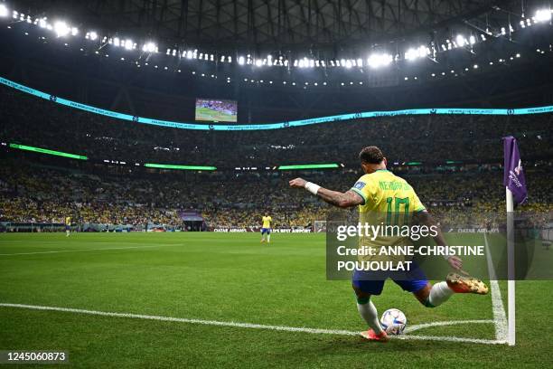 Brazil's forward Neymar takes a corner kick during the Qatar 2022 World Cup Group G football match between Brazil and Serbia at the Lusail Stadium in...