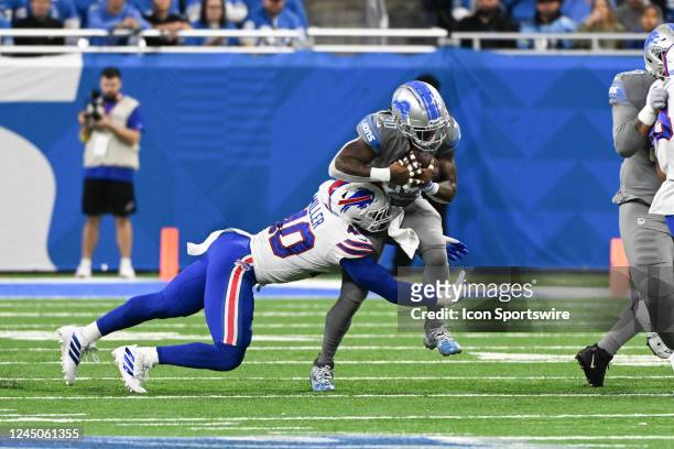 Detroit Lions running back Jamaal Williams cuts back to the middle while being tackled by Buffalo Bills linebacker Von Miller during to the Detroit...