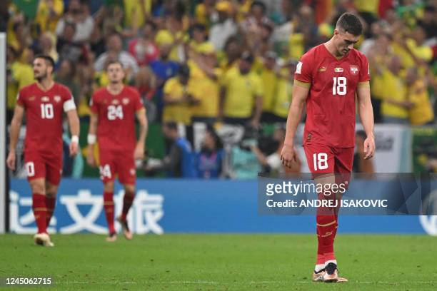 Serbia's forward Dusan Vlahovic reacts after Brazil's forward Richarlison scored Brazil's second goal during the Qatar 2022 World Cup Group G...