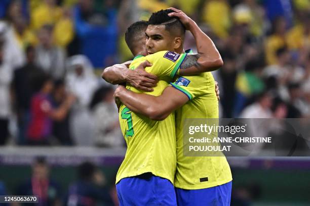 Brazil's defender Thiago Silva and Brazil's midfielder Casemiro celebrate after defeating Serbia 2-0 in the Qatar 2022 World Cup Group G football...
