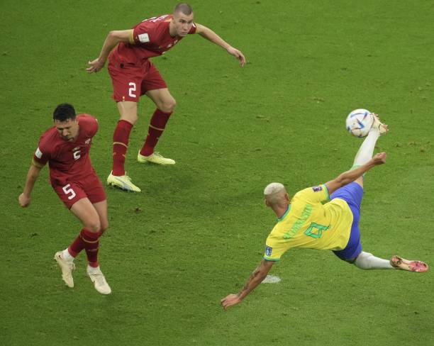 Richarlison of Brazil in action against Strahinja PavloviÄ and MiloÅ¡ VeljkoviÄ of Serbia during the FIFA World Cup Qatar 2022 Group G match between...