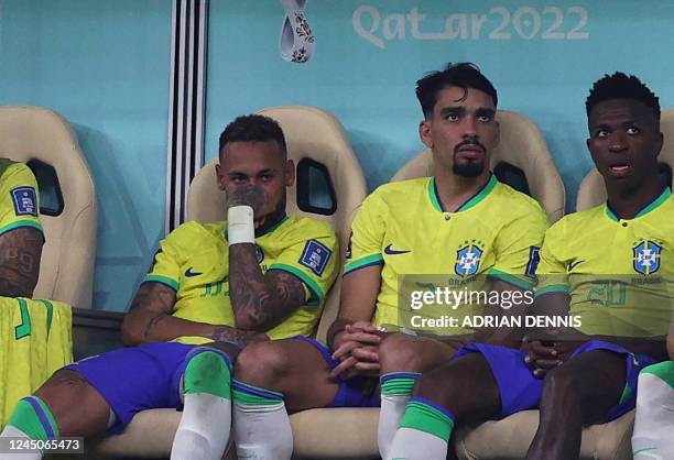 Brazil's forward Neymar sits on the bench after being substituted during the Qatar 2022 World Cup Group G football match between Brazil and Serbia at...