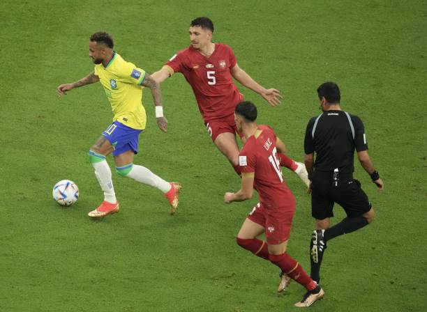 Neymar of Brazil in action against MiloÅ¡ VeljkoviÄ of Serbia during the FIFA World Cup Qatar 2022 Group G match between Brazil and Serbia at Lusail...