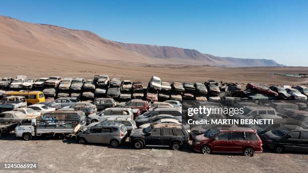 Hundreds of vehicles remain at the Los Verdes municipal landfill in the Atacama Desert, 30 km south of the city of Iquique, Chile, on November 12,...