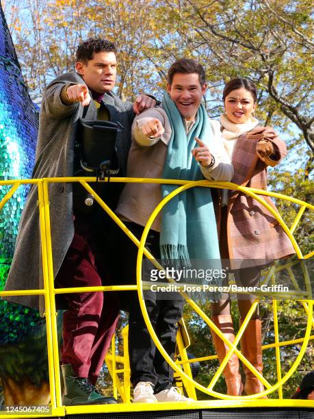 Flula Borg, Adam DeVine and Sarah Hyland are seen attending the 2022 Macy's Thanksgiving Day Parade on November 24, 2022 in New York City.