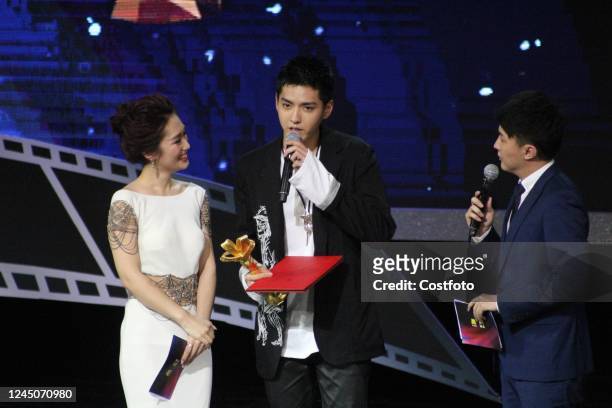 Singer Kris Wu receives the Best New Artist award at the 19th Shanghai International Film Festival Media Awards in Shanghai, June 18, 2016. On the...