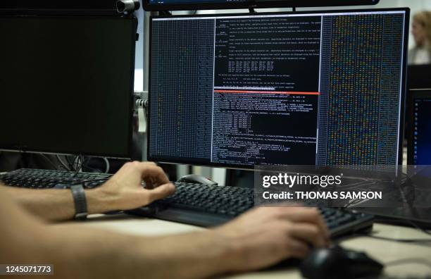 An agent of the operational center of the French National Cybersecurity Agency checks datas on a computer in Paris on November 24, 2022.