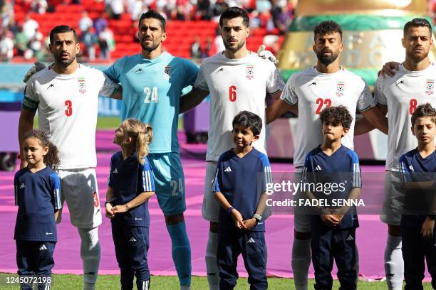 Iran's defender Ehsan Hajsafi, Iran's goalkeeper Hossein Hosseini, Iran's midfielder Saeid Ezatolahi, Iran's goalkeeper Amir Abedzadeh and Iran's...