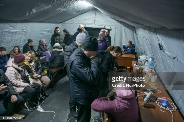 Local residents charge their devices, use internet connection and warm up inside Centre of Invincibility after critical civil infrastructure was hit...