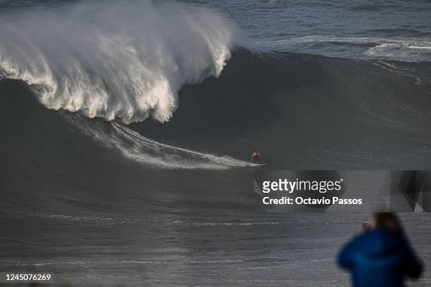 Big wave surfer Lucas Chianca Chumbo from Brazil rides a wave during a surfing session at Praia do Norte on November 25, 2022 in Nazare, Portugal.
