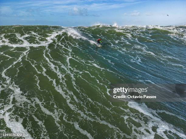 Big wave surfer Lucas Chianca Chumbo from Brazil rides a wave during a surfing session at Praia do Norte on November 25, 2022 in Nazare, Portugal.