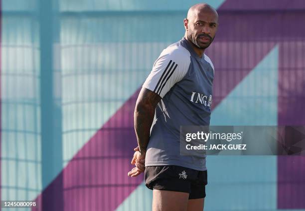 Belgium's French assistant coach Thierry Henry looks on duirng a training session at Salwa Training site, southwest of Doha on November 25 during the...