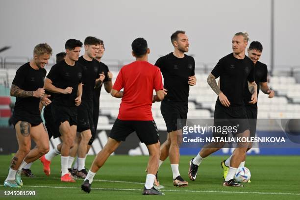 Denamrk's players take part in a training session at Al Sailiya SC in Doha on November 25 on the eve of the Qatar 2022 World Cup football tournament...