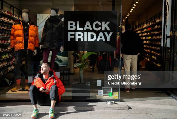 Shopper in the sunshine outside a store on Black Friday in Madrid, Spain, on Friday, Nov. 25, 2022. European Central Bank Executive Board...