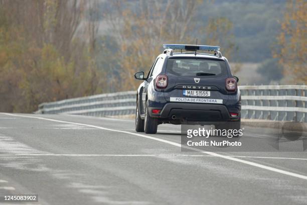 Police car from Romania patrolling the Greek borders as part of the FRONTEX border police agency force. Asylum seekers at the Balkan Route, a refugee...