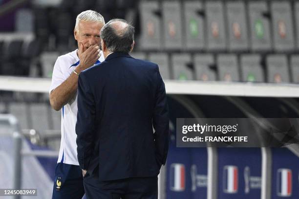 France's coach Didier Deschamps speaks with French Football Federation President Noel Le Graet during a training session at Al Sadd SC Stadium in...