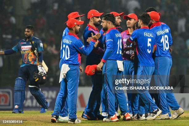 Afghanistan team celebrates their victory in the first one-day international cricket match between Sri Lanka and Afghanistan at the Pallekele...