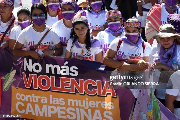 Women take part in a demonstration to demand justice for the victims of femicide, outside the Public Ministry headquarters in Tegucigalpa, on...