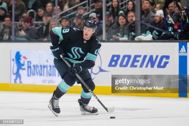 Jared McCann of the Seattle Kraken skates with the puck during the first period of a game against the Los Angeles Kings at Climate Pledge Arena on...