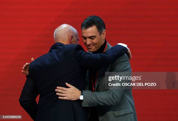 Spanish Prime Minister Pedro Sanchez hug current president of the Socialist International, former Greek Prime minister George Papandreou during the...