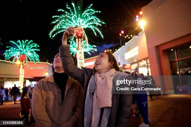 Rain Sun, left, and Hyeonmi Seol, of Los Angeles, along with other shoppers enjoy exclusive Black Friday deals on Thanksgiving night through the...