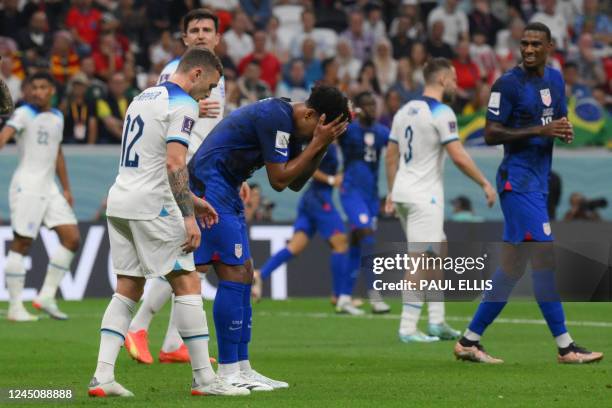 S midfielder Weston McKennie reacts to a missed chance during the Qatar 2022 World Cup Group B football match between England and USA at the Al-Bayt...