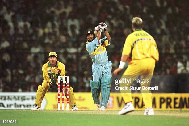 Sachin Tendulkar of India plays a shot off the bowling of Shane Warne of Australia during the Cricket World Cup match between Australia and India in...
