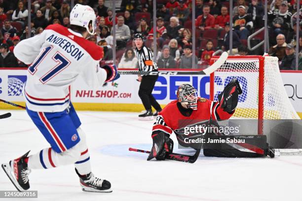 Goaltender Arvid Soderblom of the Chicago Blackhawks makes a glove save on a shot from Josh Anderson of the Montreal Canadiens in the first period on...