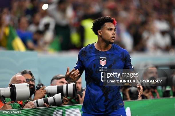 S midfielder Weston McKennie reacts during the Qatar 2022 World Cup Group B football match between England and USA at the Al-Bayt Stadium in Al Khor,...