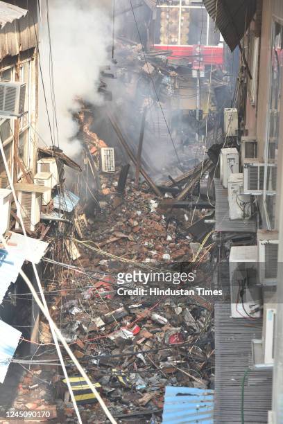 View of burnt and damaged shops after a major fire broke out at Bhagirath palace market, wholesale hub for electrical household goods, on November...
